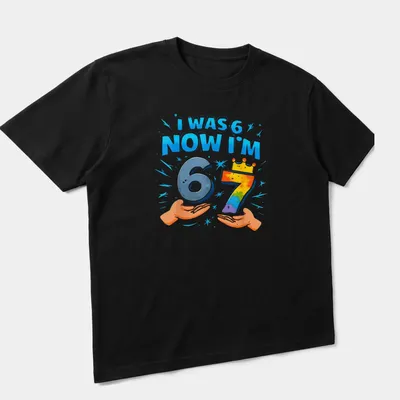 Colorful birthday shirt with playful text celebrating a child's seventh birthday — angled view