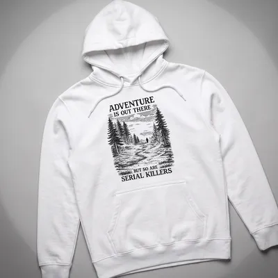 Vintage illustration of a forest with a shadowy figure and text about adventure and serial killers — printed on a unisex hoodie