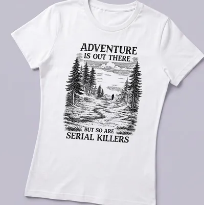 Vintage illustration of a forest with a shadowy figure and text about adventure and serial killers — printed on a women's shirt
