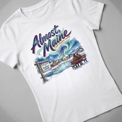 Colorful illustration of a couple sitting on a snowy bench with the title of the play above them. — printed on a women's shirt