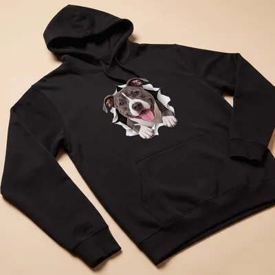 Realistic print of an American Staffordshire Terrier with a playful expression in gray, white, and black. — printed on a unisex hoodie