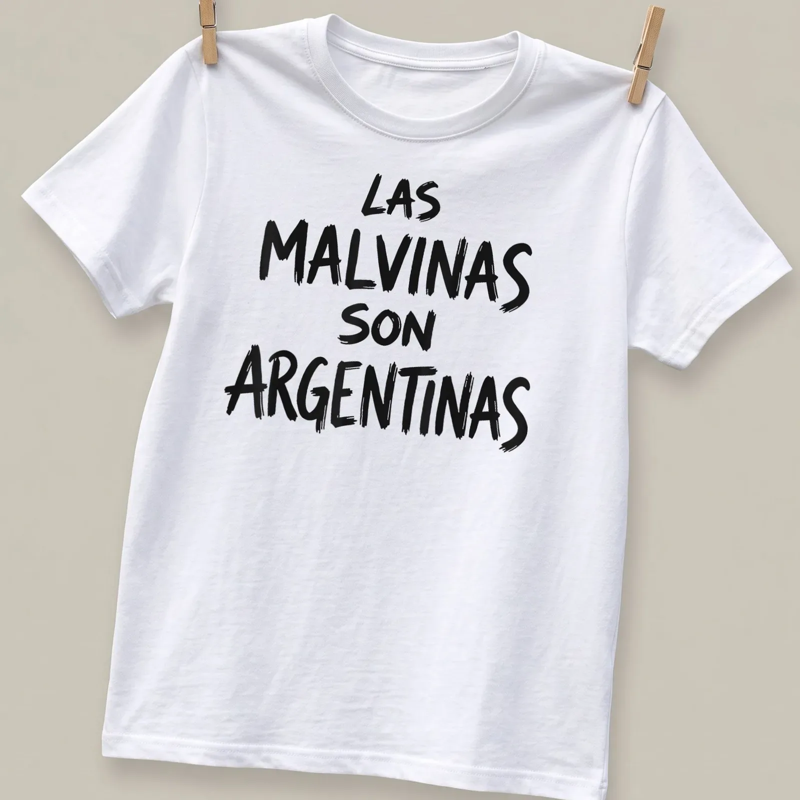 Bold brush script saying LAS MALVINAS SON ARGENTINAS on a — printed on a unisex t-shirt