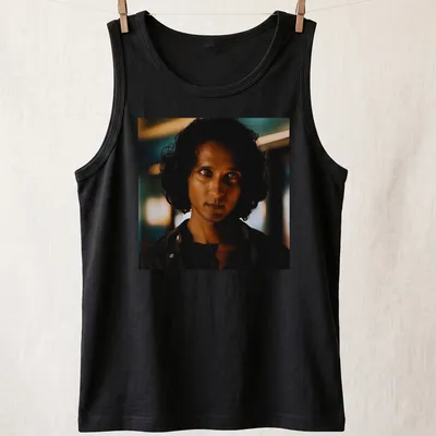 Dramatic portrait of Armand in dark hues with blue and gold accents — printed on a tank top