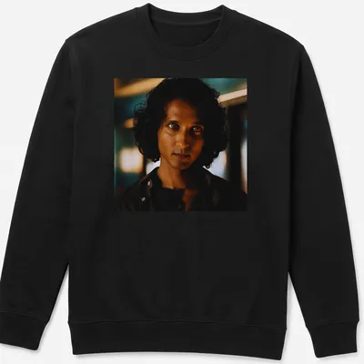 Dramatic portrait of Armand in dark hues with blue and gold accents — printed on a unisex sweatshirt