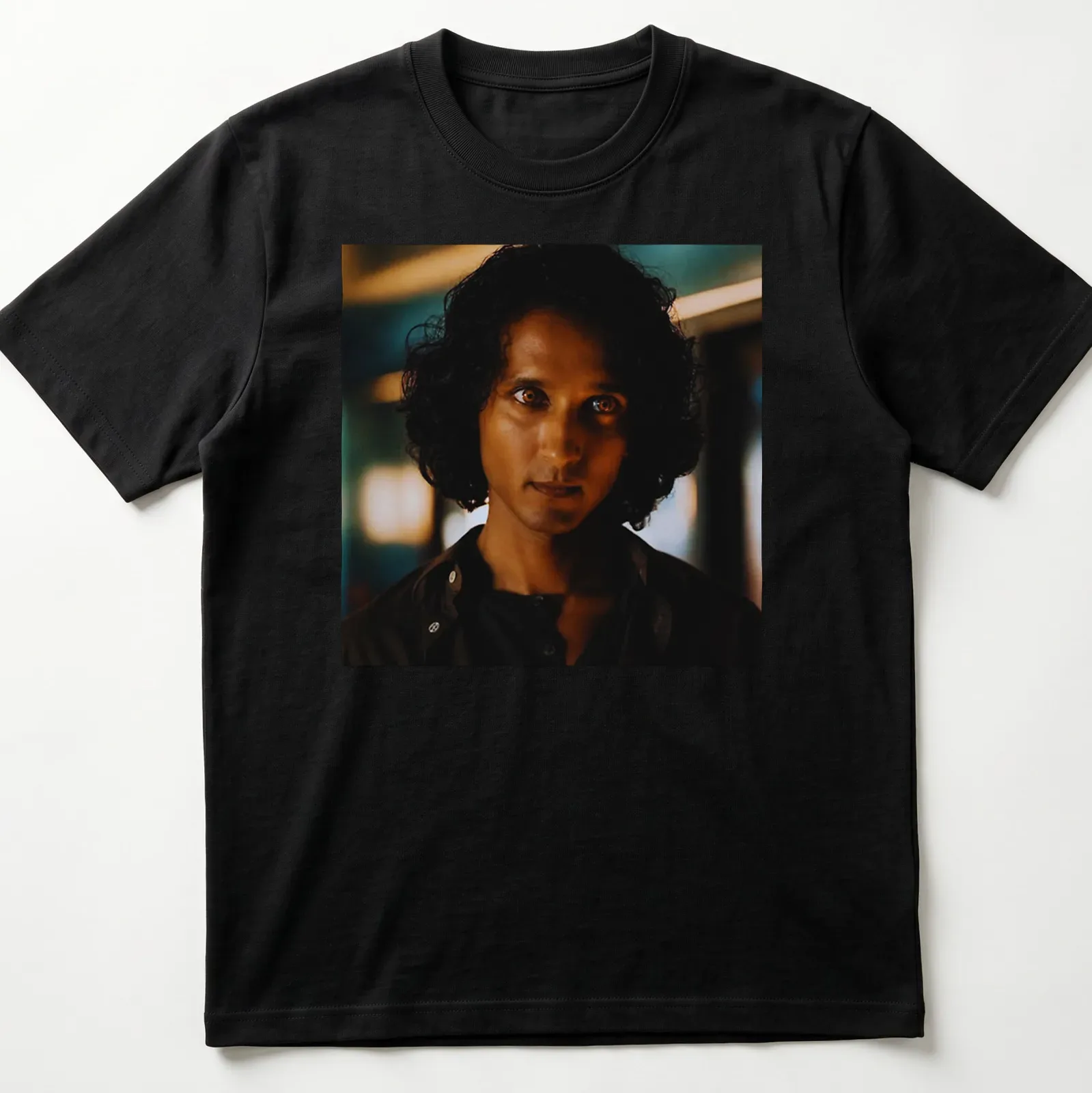 Dramatic portrait of Armand in dark hues with blue and gold accents — printed on a unisex t-shirt
