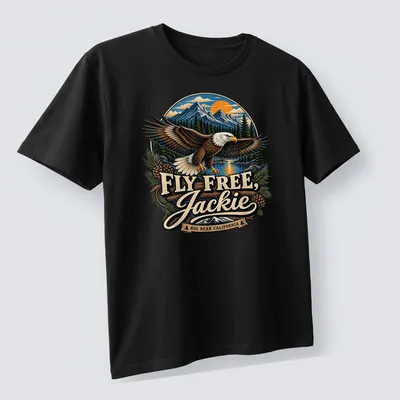 Vintage illustration of a Bald Eagle with text about Jackie Big Bear, California — printed on a unisex t-shirt (angled view)