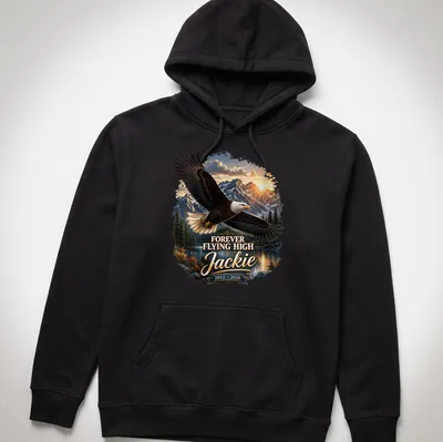 Realistic Bald Eagle soaring with text 'FOREVER FLYING HIGH Jackie 2012 - 2026' — printed on a unisex hoodie