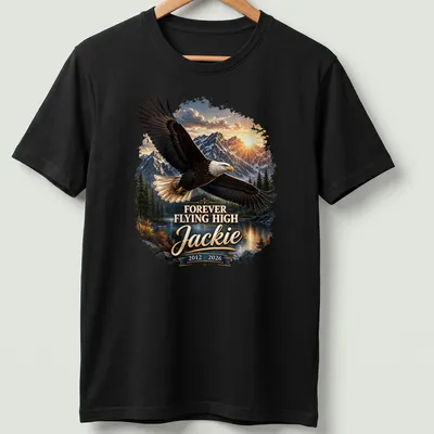 Realistic Bald Eagle soaring with text 'FOREVER FLYING HIGH Jackie 2012 - 2026'