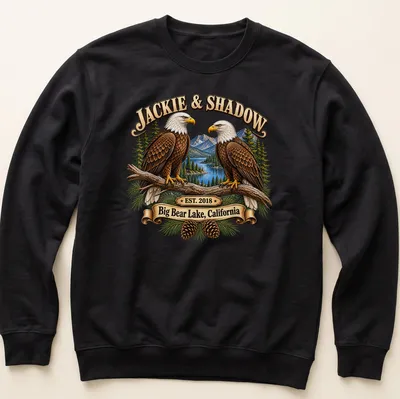 Illustration of Bald Eagles with text about Big Bear Lake and establishment year. — printed on a unisex sweatshirt