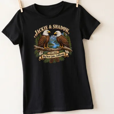 Illustration of Bald Eagles with text about Big Bear Lake and establishment year. — printed on a women's shirt