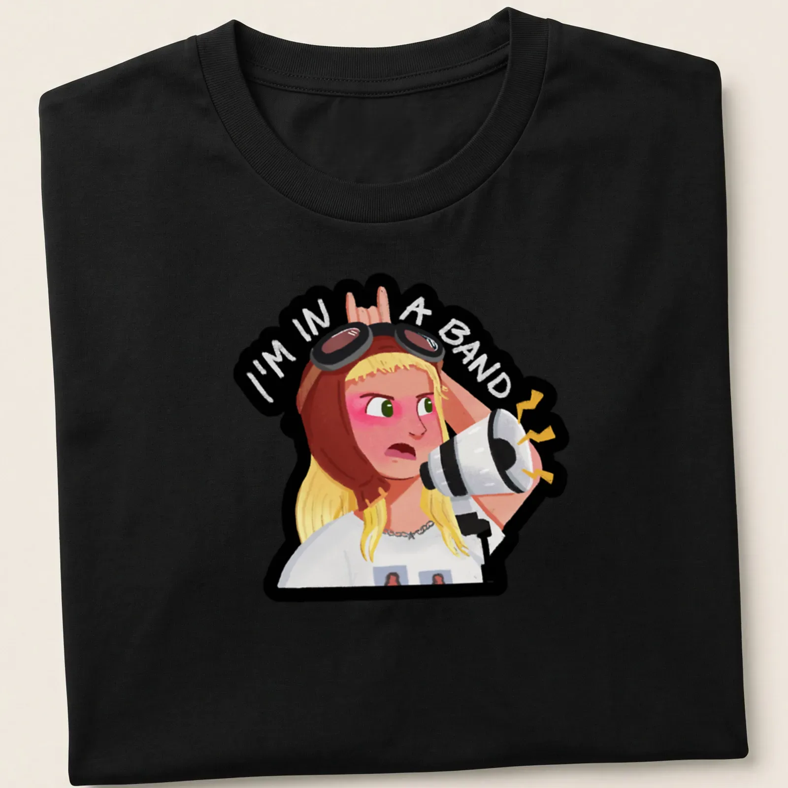 Kawaii illustration of a band girl with a microphone and text reading 'I'm in a band' — printed on a unisex t-shirt