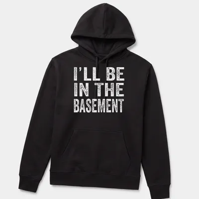 Casual black and white t-shirt with the phrase 'I'll Be In The Basement' printed on it — printed on a unisex hoodie