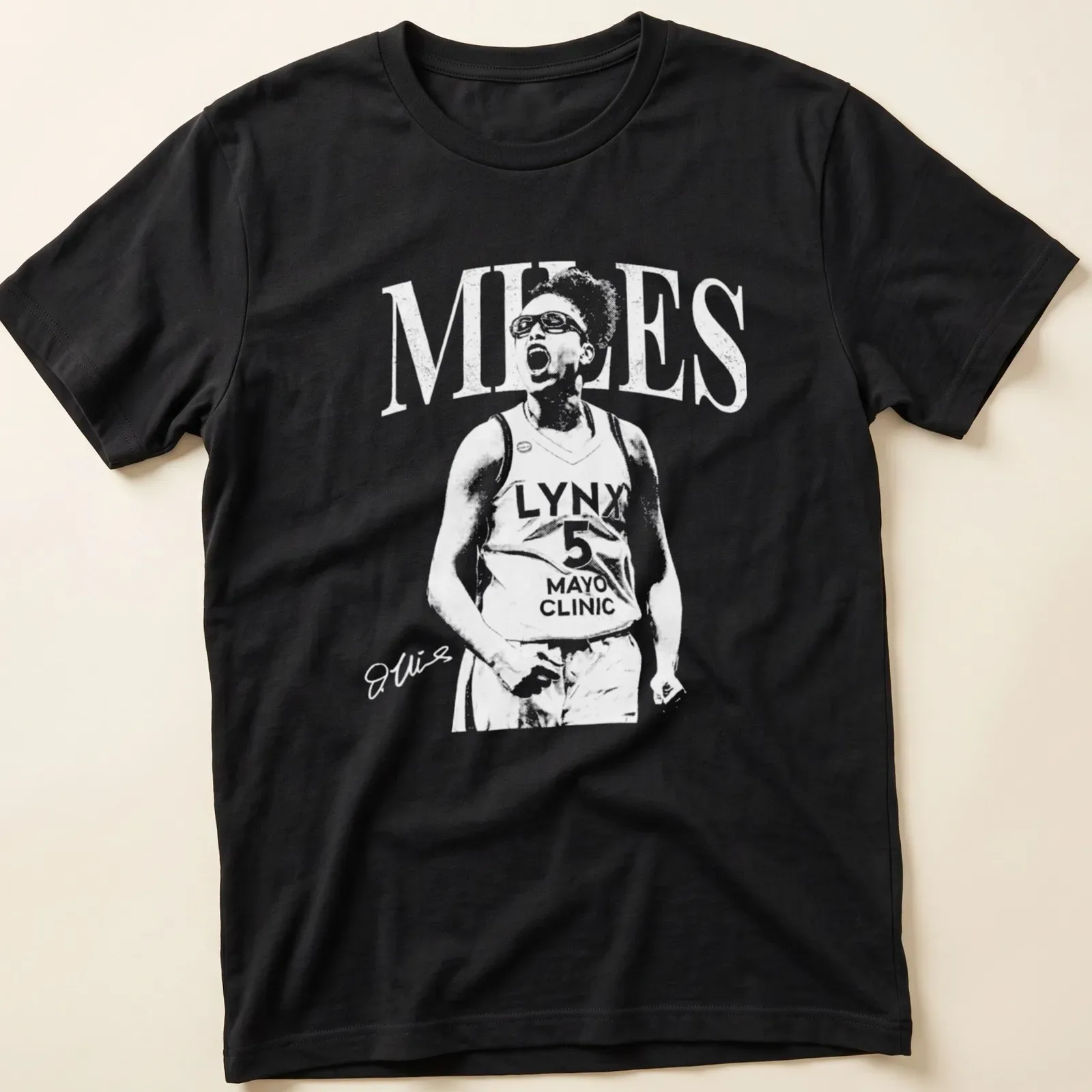 Silhouette of a basketball player in motion, featuring black, white, and orange colors — printed on a unisex t-shirt