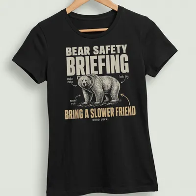 Vintage illustration t-shirt with bear safety briefing text in playful font — printed on a women's shirt