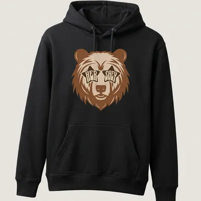 Playful bear wearing star sunglasses with retro text 'HER SHEY' above — printed on a unisex hoodie