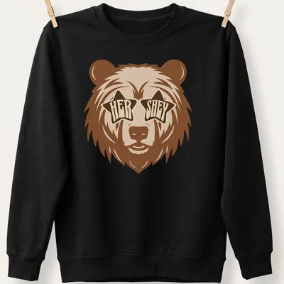 Playful bear wearing star sunglasses with retro text 'HER SHEY' above — printed on a unisex sweatshirt