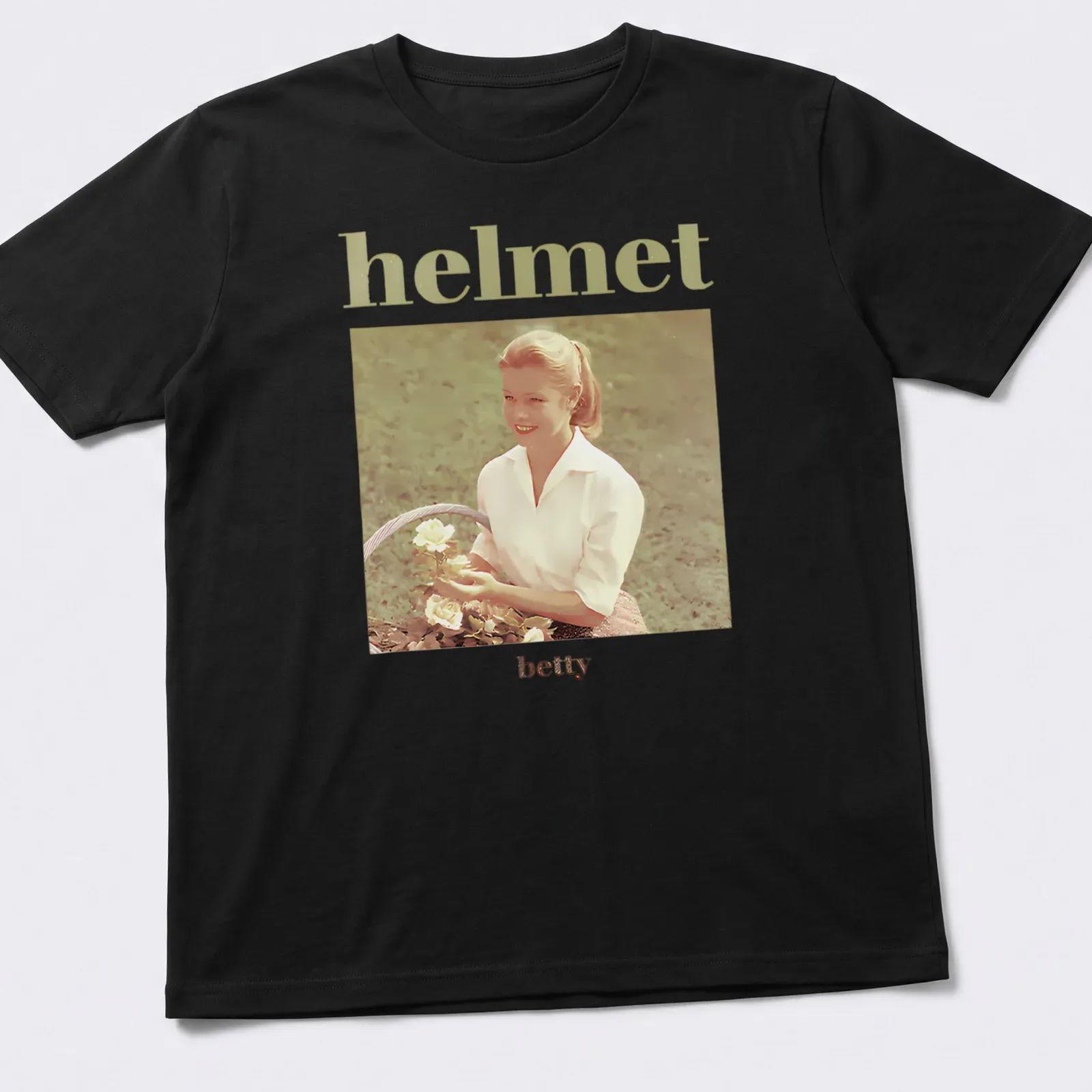 Vintage design of a woman holding roses with text 'helmet betty' above — printed on a unisex t-shirt