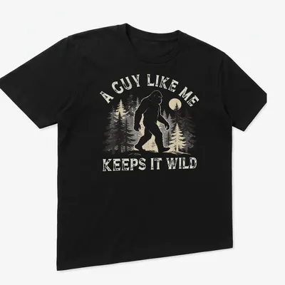 Retro distressed Bigfoot t-shirt with humorous text about keeping it wild — printed on a unisex t-shirt (angled view)