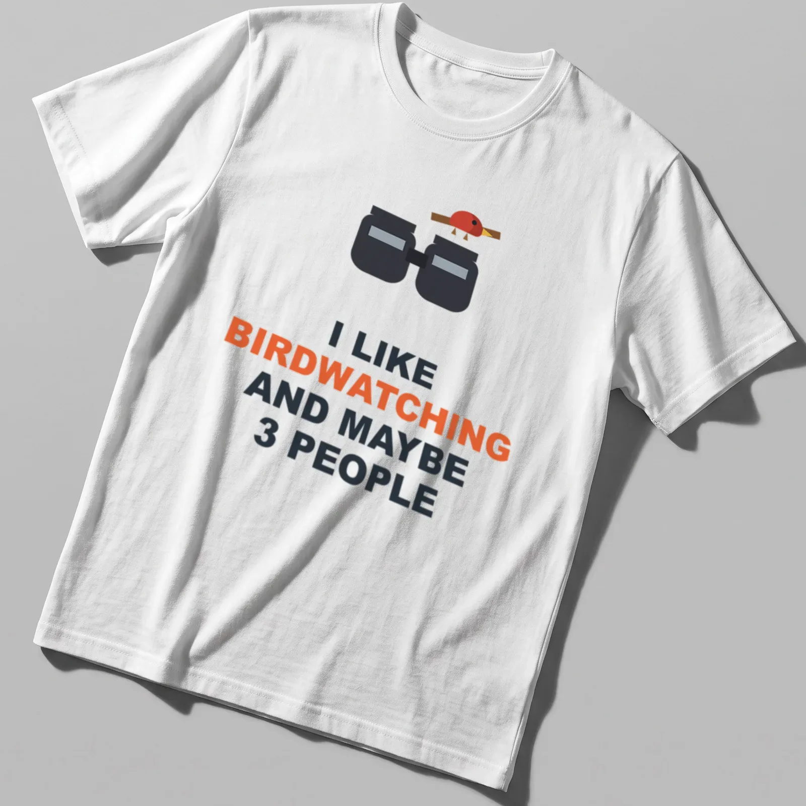 T-shirt featuring binoculars and a bird with humorous text about birdwatching — printed on a unisex t-shirt