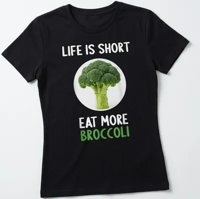 Modern shirt with a clean design featuring broccoli and humorous text about eating more vegetables — printed on a women's shirt