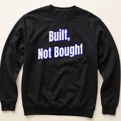 Bold typography saying 'Built, Not Bought' on a motivational — printed on a unisex sweatshirt