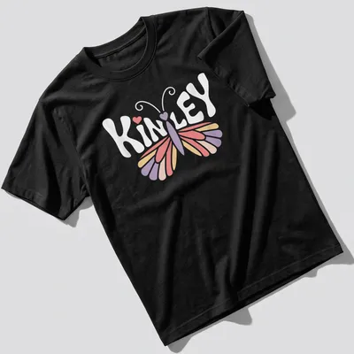 Vintage t-shirt with the name Kinley and a butterfly design in pastel colors