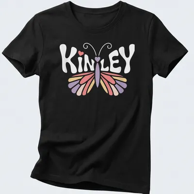 Vintage t-shirt with the name Kinley and a butterfly design in pastel colors — printed on a women's shirt