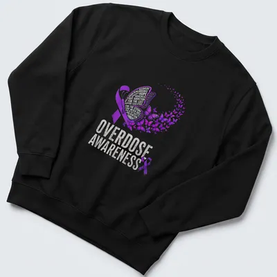 Vibrant butterfly design with text about overdose awareness and hope — printed on a unisex sweatshirt