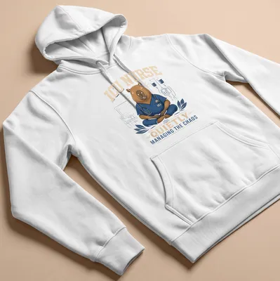 Cartoon capybara nurse in scrubs managing chaos with medical tools — printed on a unisex hoodie