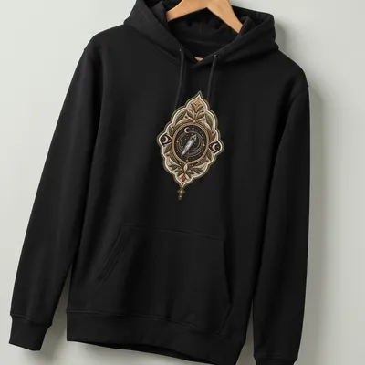 Embroidered celestial compass badge on a T-shirt in various colors — printed on a unisex hoodie