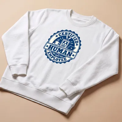 Vintage badge design with 'Certified Human Employee' text and illustrations of coffee cup and laptop — printed on a unisex sweatshirt
