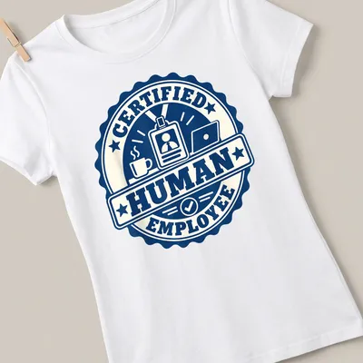 Vintage badge design with 'Certified Human Employee' text and illustrations of coffee cup and laptop — printed on a women's shirt