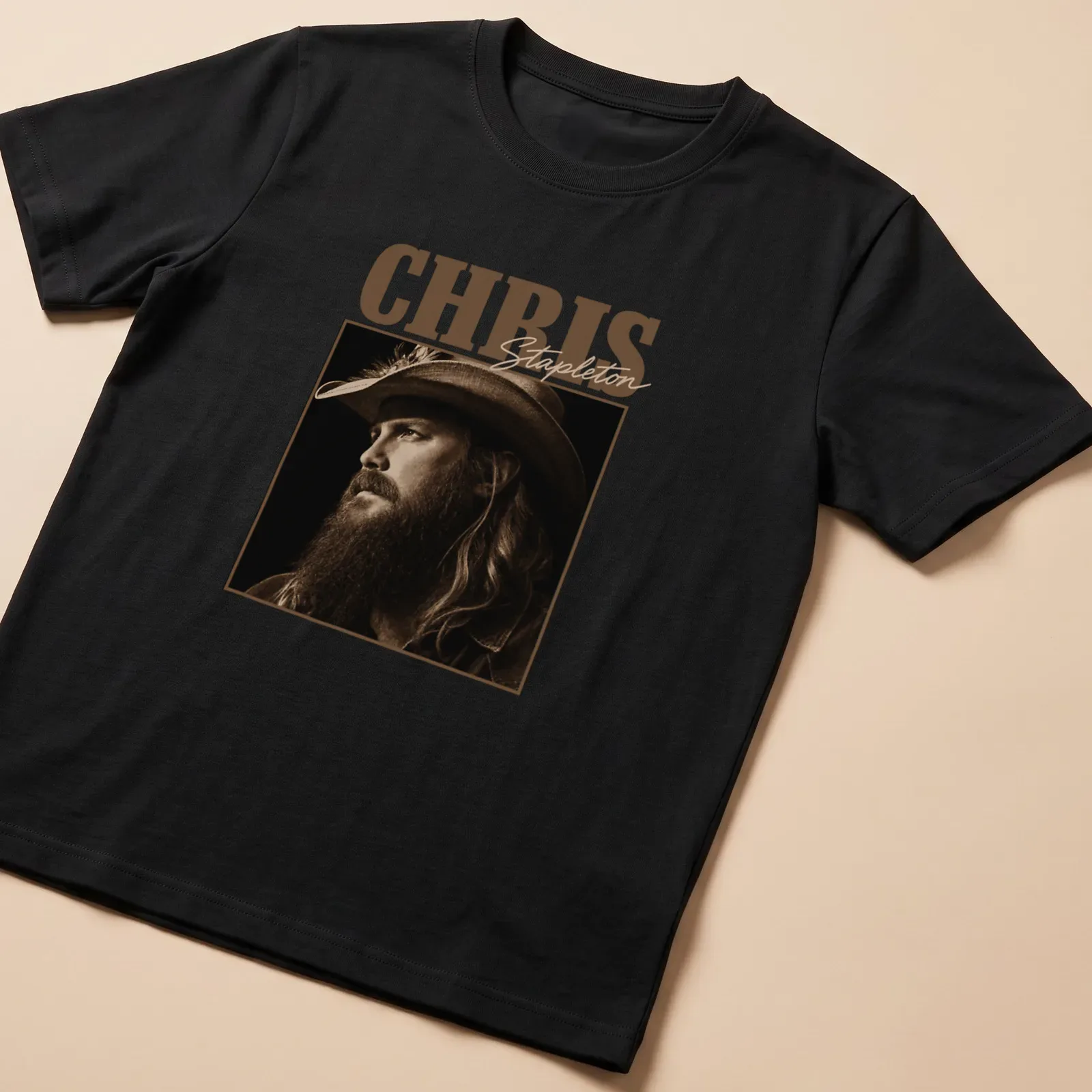 Vintage sepia t-shirt featuring Chris Stapleton's name in bold lettering — printed on a unisex t-shirt