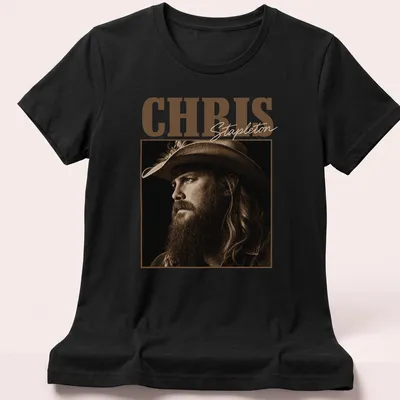 Vintage sepia t-shirt featuring Chris Stapleton's name in bold lettering — printed on a women's shirt