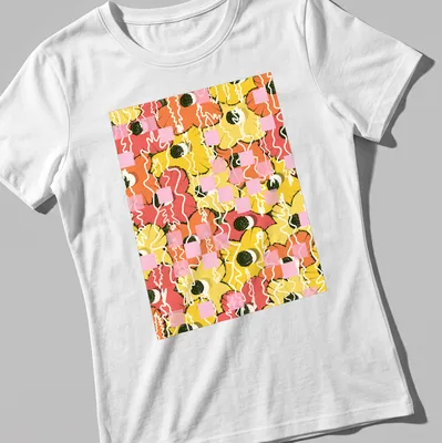 Illustration of colorful citrus flowers in orange, pink, yellow, green, and white. — printed on a women's shirt