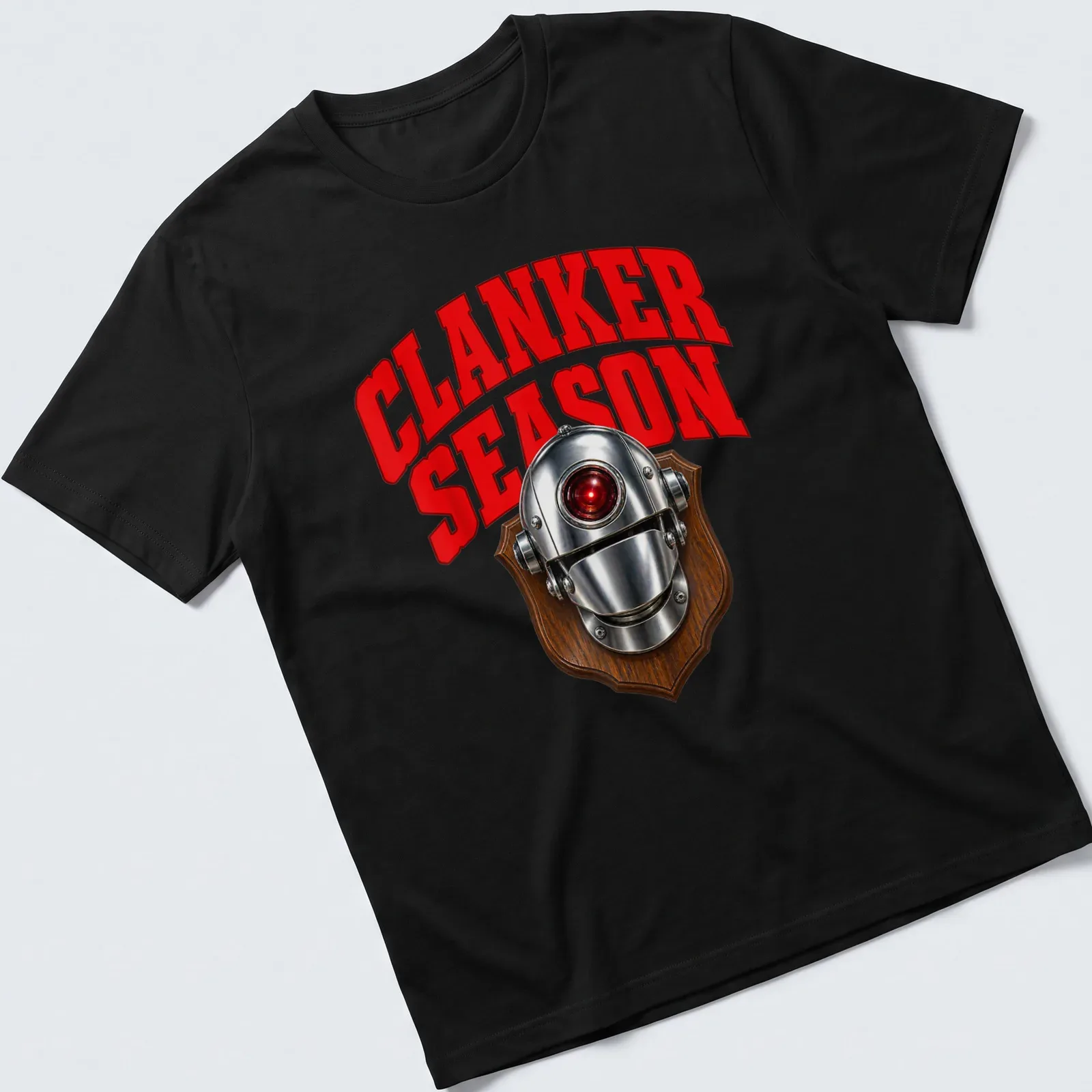 Bold graphic of a robot head with the text CLANKER SEASON in red and silver — printed on a unisex t-shirt