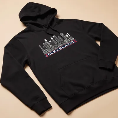Vintage-style t-shirt featuring Cleveland skyline with bold lettering — printed on a unisex hoodie