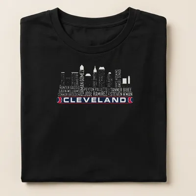 Vintage-style t-shirt featuring Cleveland skyline with bold lettering — printed on a women's shirt