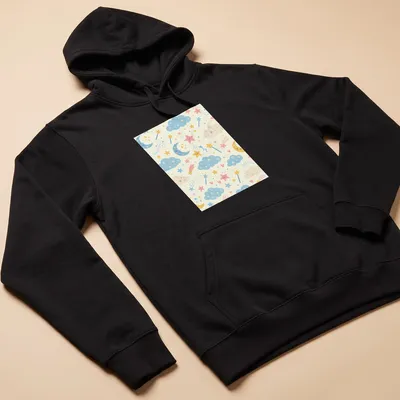 Cute whimsical clouds and stars seamless pattern in light blue, pink, yellow, and cream — printed on a unisex hoodie