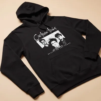 Vintage Cocteau Twins t-shirt with black and white text and stylish font — printed on a unisex hoodie