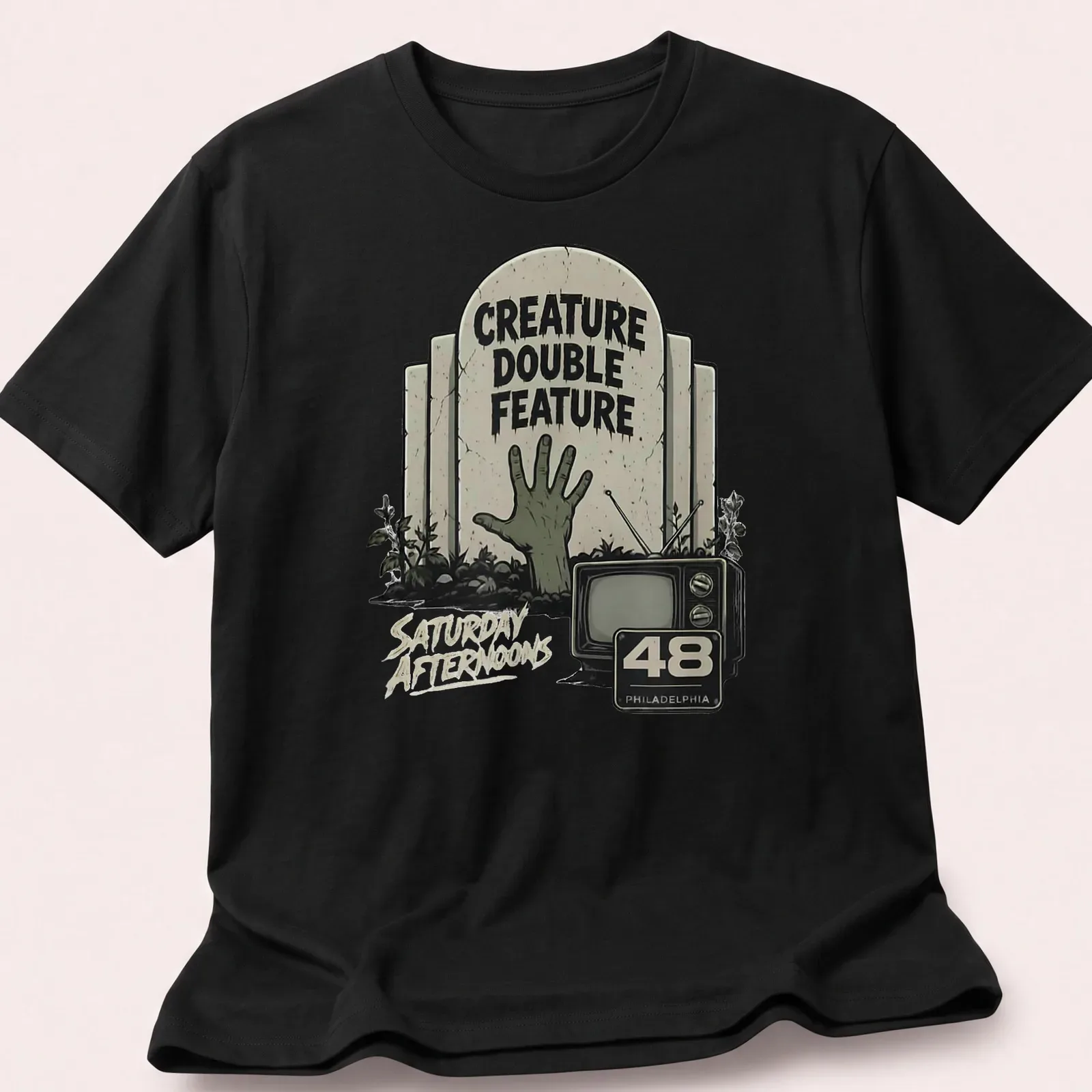 Vintage horror t-shirt featuring a zombie hand and retro television design — printed on a unisex t-shirt