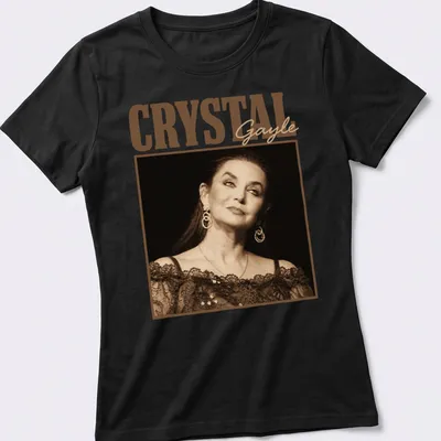 Vintage portrayal of Crystal Gayle in warm tones with her name printed — printed on a women's shirt
