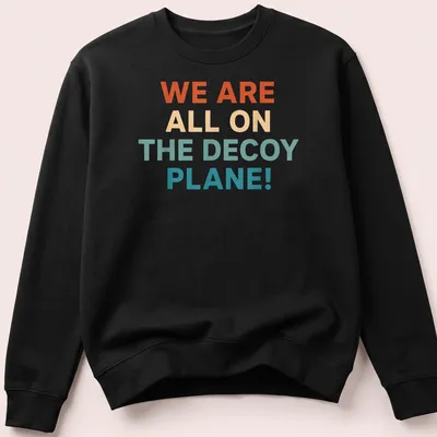 Colorful decoy plane graphic with bold text proclaiming we are all on the decoy plane — printed on a unisex sweatshirt