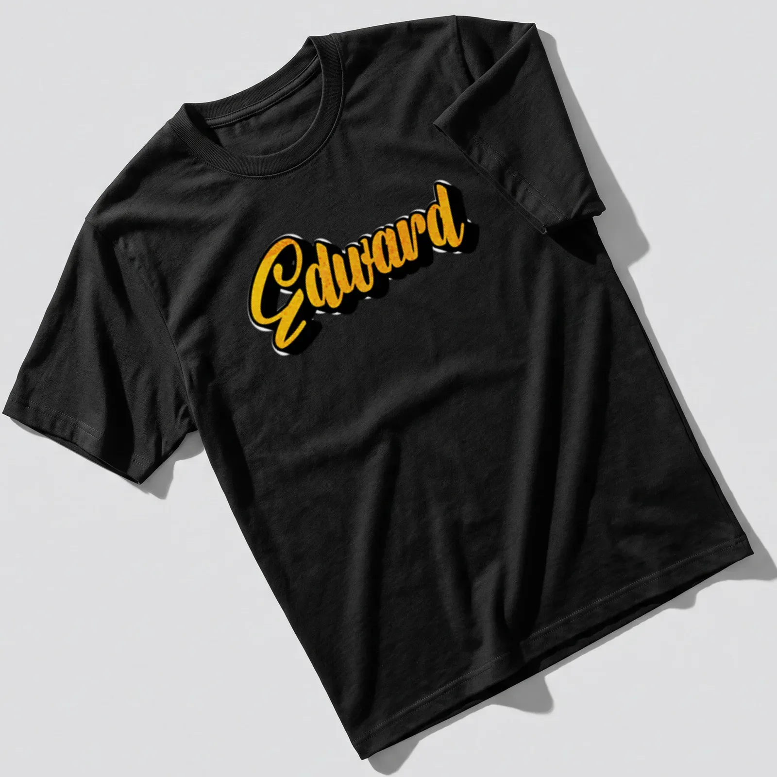 Bold yellow script of the name Edward on a black — printed on a unisex t-shirt