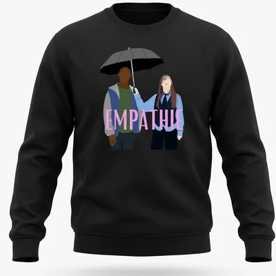 Flat design of two figures sharing an umbrella with the word 'EMPATHIE' above them — printed on a unisex sweatshirt