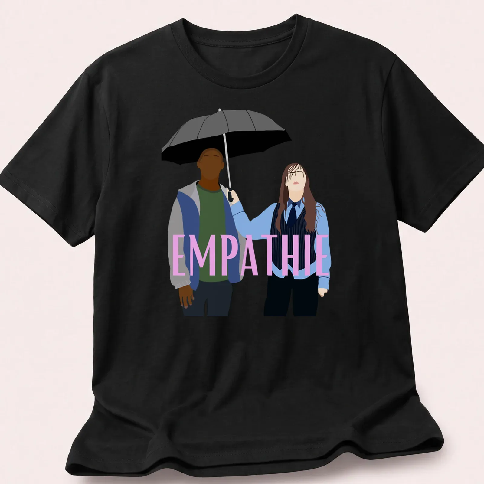Flat design of two figures sharing an umbrella with the word 'EMPATHIE' above them — printed on a unisex t-shirt