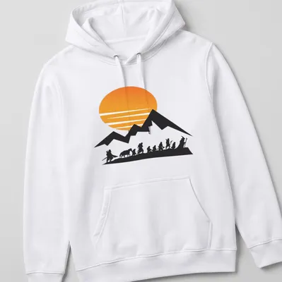 Silhouette of travelers at sunrise with mountains in the background — printed on a unisex hoodie