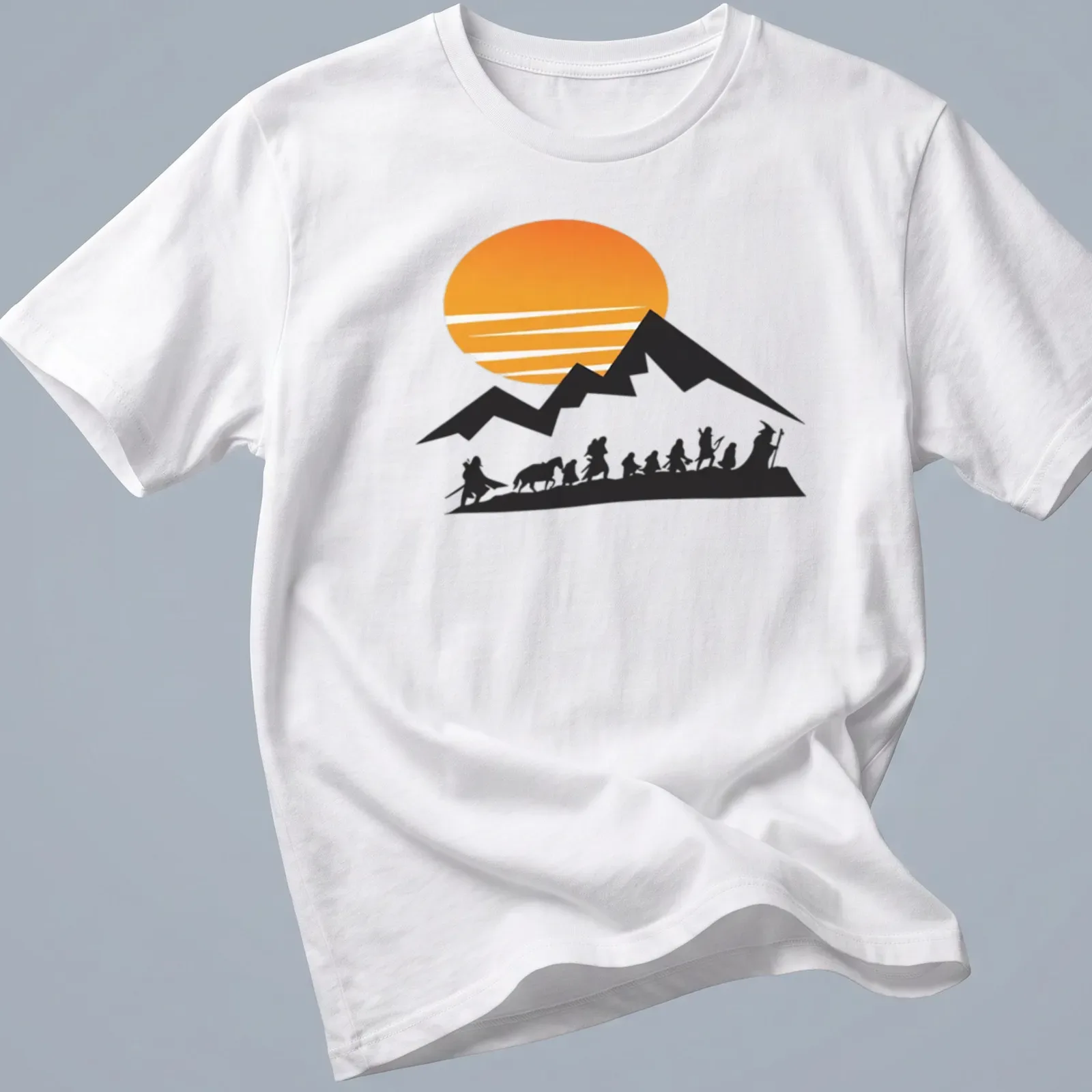 Silhouette of travelers at sunrise with mountains in the background — printed on a unisex t-shirt