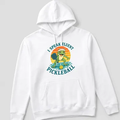 Vintage cartoon frog t-shirt featuring the phrase 'I Speak Fluent Pickleball' in colorful lettering — printed on a unisex hoodie