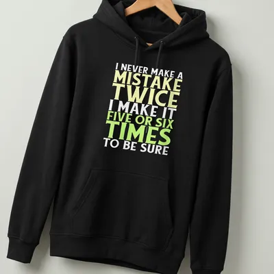 Bold typography t-shirt with funny mistake quote in yellow, green, and white — printed on a unisex hoodie